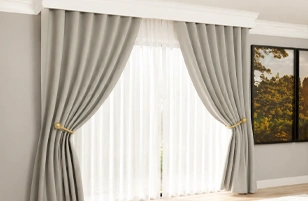 Modern grey layered window curtains by Curtain Suppliers in Riyadh for stylish interior décor.