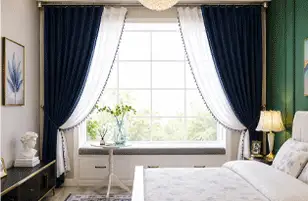 Modern navy blue and white curtains in a bedroom from curtain stores in Riyadh.