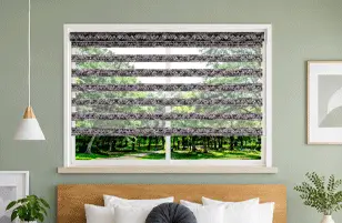 Premium layered blinds with outdoor garden view.