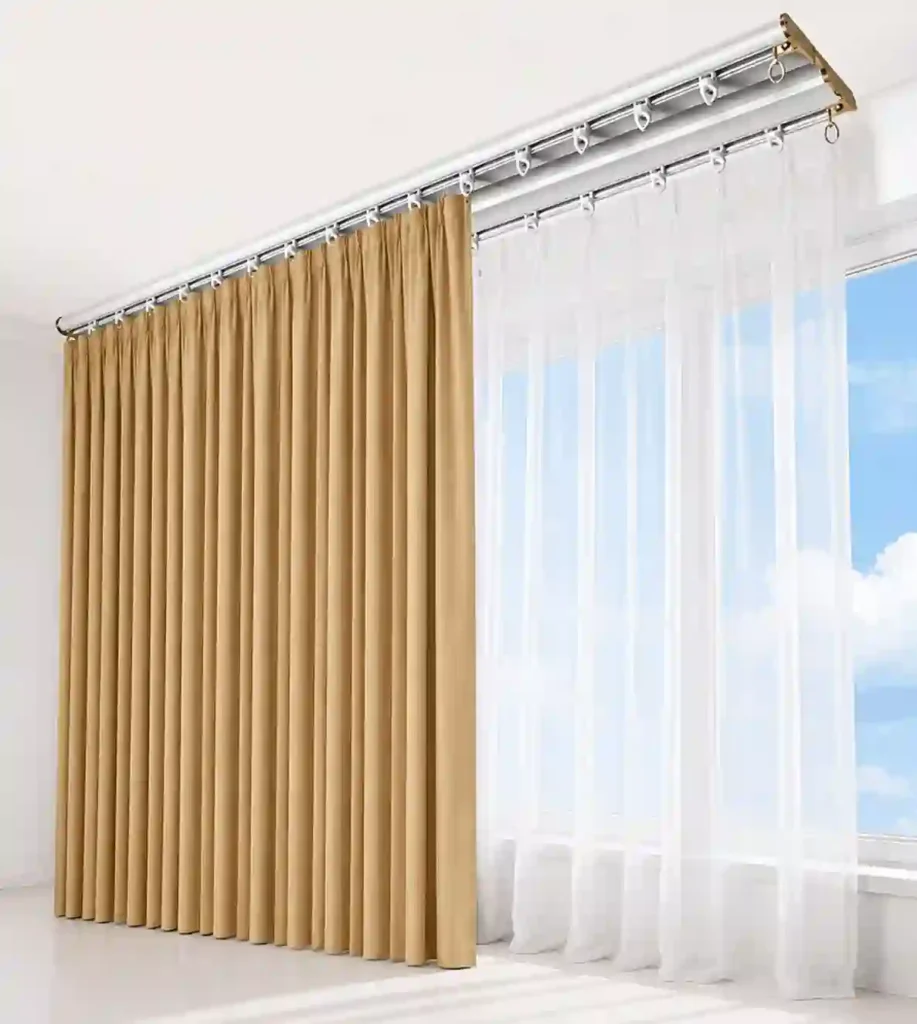 Modern double-track curtain system with layered drapes and sheer panels installed on a ceiling-mounted rail.