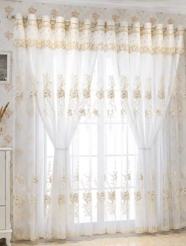 Elegant sheer curtains in Riyadh featuring embroidered floral patterns and soft light-filtering fabric.