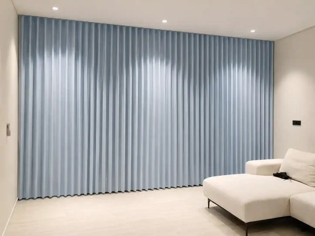 Light grey wall curtains in a modern bedroom.